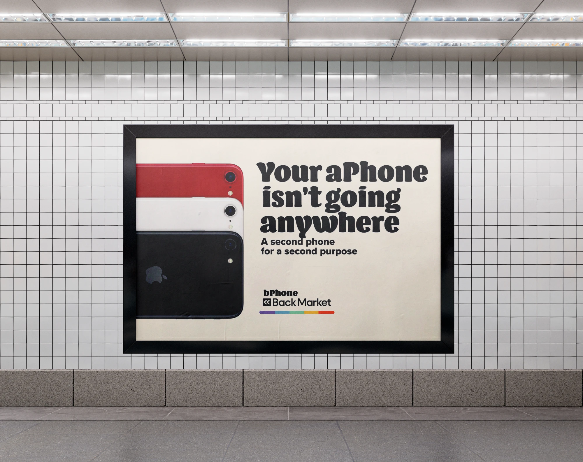 Subway poster on a tiled wall: red, white and black iPhones stacked, 'Your aPhone isn't going anywhere'